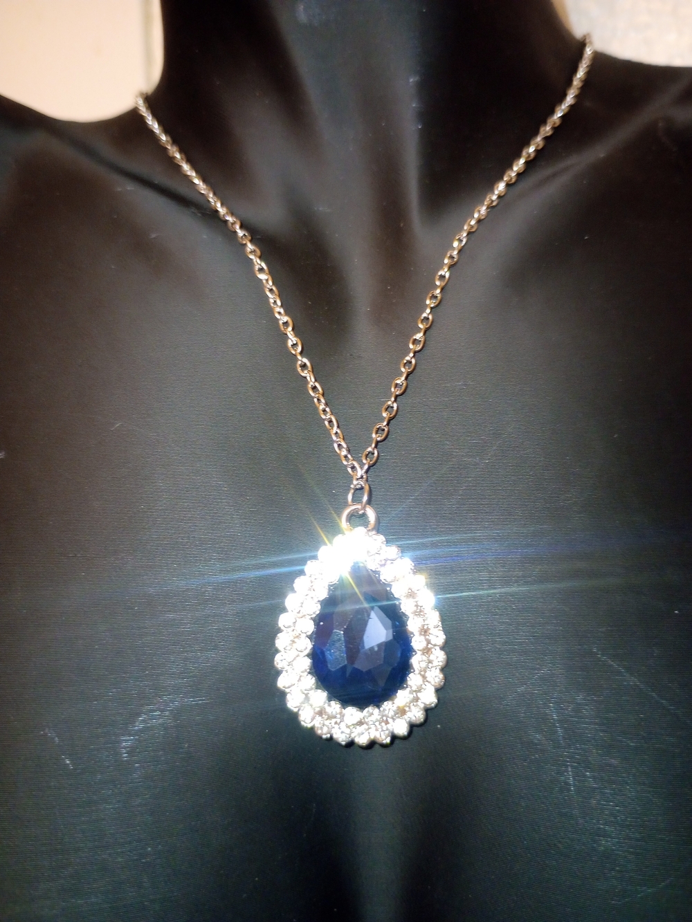 Elegant Silver Tone Necklace with Blue Teardrop Pendant